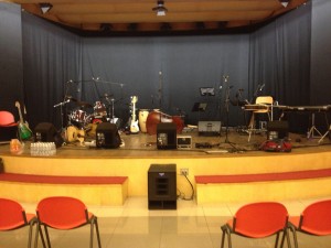 The stage viewed from the audience; the harp setup is just right of center