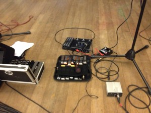 My rig, view from front of stage.  L to R: big harp case, small harp case with Audix Fireball, RP360, ABY pedal, direct box.